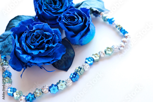 Greeting card mockup with blue roses on a white background
