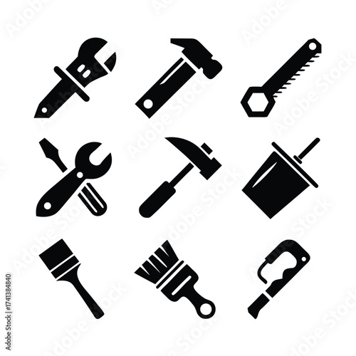 Collection of black silhouette icons of various tools including wrenches hammers saws paintbrushes and screwdrivers