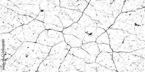 Grunge textured surface of an old cracked concrete wall with peeling paint and dry plaster