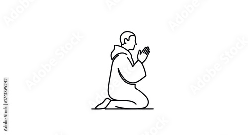 Monk in prayer kneeling with hands clasped in devotion.