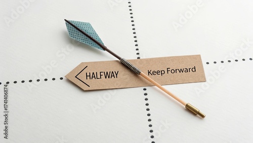 Paper arrow pointing halfway across a dotted line showing forward direction