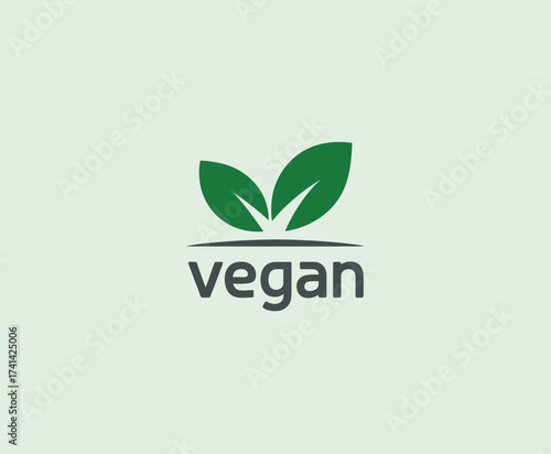 This image showcases two stylized green leaves that symbolize a vegan lifestyle, reflecting compassion towards animals and a commitment to sustainable living practices.