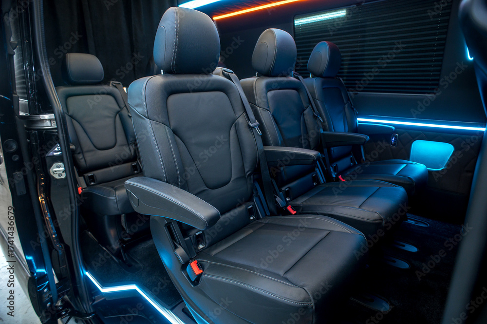 Obraz premium Comfortable interior of a passenger bus with soft seats