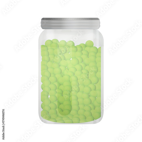 A clear glass jar filled with many small round light green objects on a black background