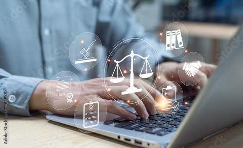 Legal and governance concept showing businessman with holographic justice, law, and compliance icons, symbolizing corporate law, regulations, and balanced authority