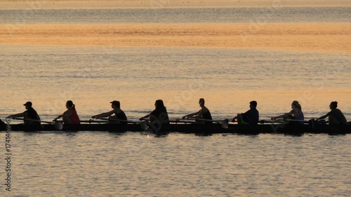 Female Rowing Team on Lake