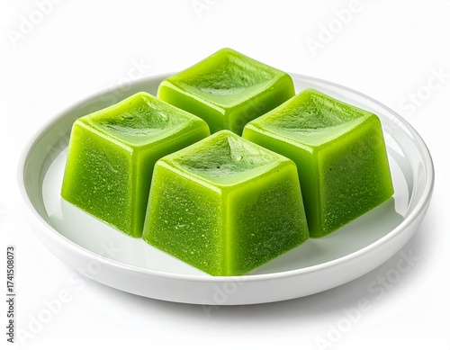 green pudding on a plate isolated on white