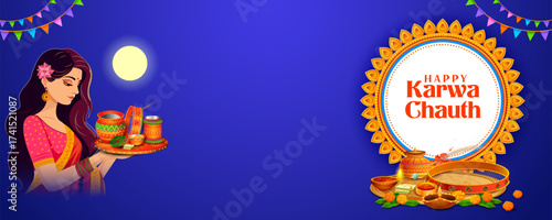 Indian woman performing Hindu married festival ritual of Karwa Cahuth looking moon through sieve