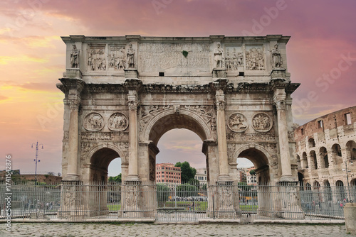 The majestic Arch of Constantine, a famous ancient Roman triumphal arch and monument in Rome, Italy, with the Colosseum in the background under a beautiful sunset sky