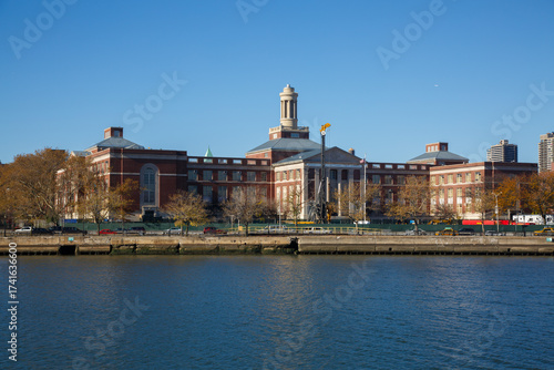 Manhattan Center for Science and Mathematics (MCSM) school and the skyline of Harlem, manhattan at the shore of Harlem river, New York City, United States
