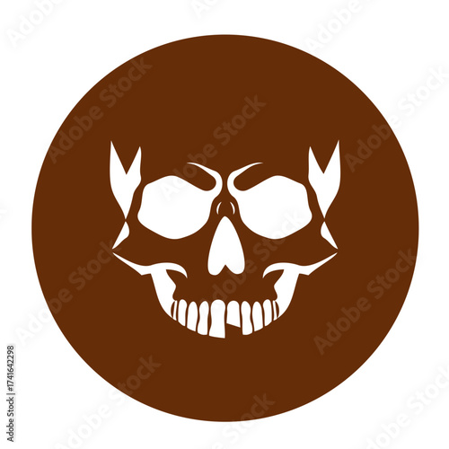 Silhouette of a skull, negative space on a brown circle background for Halloween celebration concept