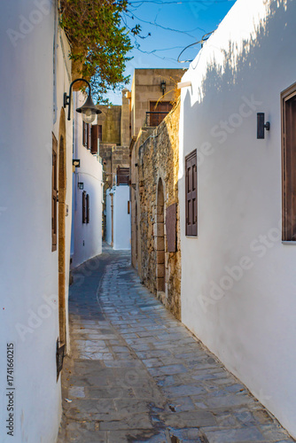 Beautiful narrow alley with whitewashed walls, Lindos, Rhodes, Greece