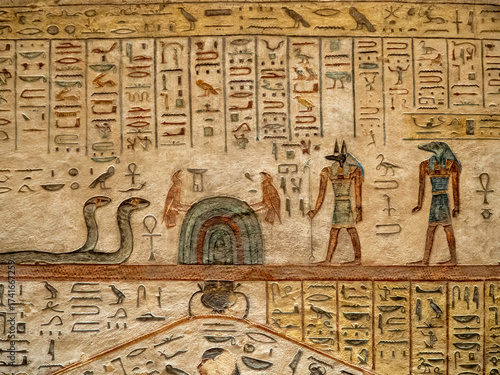 VALLEY OF THE KINGS, EGYPT : Interior of a tomb in the Valley of the Kings, featuring intricate wall paintings and hieroglyphs that tell stories of ancient Egyptian pharaohs.