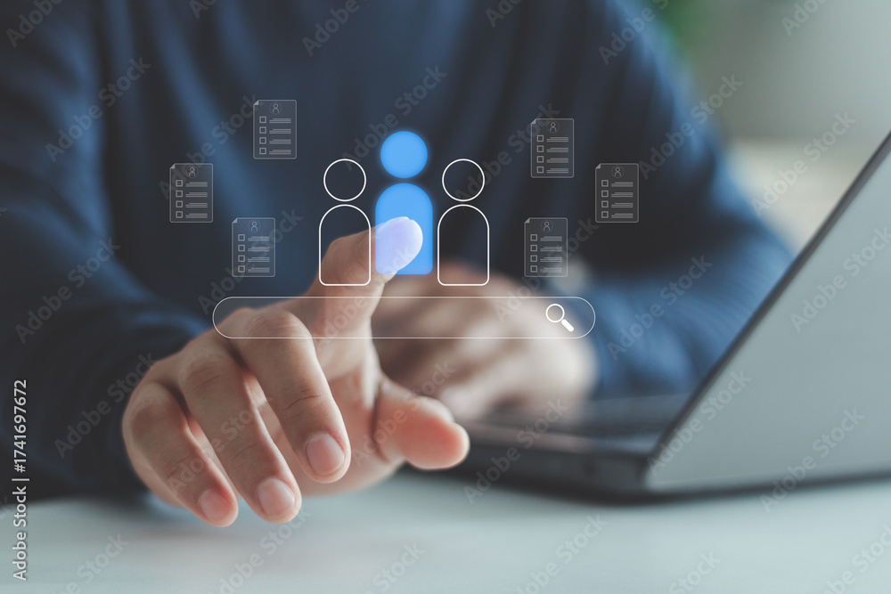 Fototapeta premium Businessman using laptop with virtual icons of resume documents and search bar, symbolizing recruitment, job search, talent acquisition, candidate selection and digital hiring process.