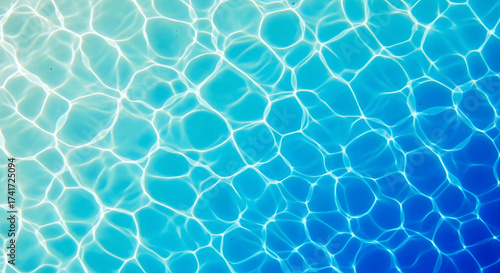 Rippling sunlit water surface with bright caustic light patterns shades of turquoise and blue