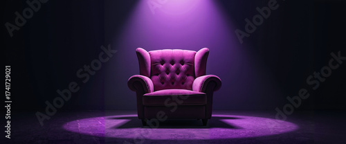 Purple velvet armchair under spotlight on dark background, theater or interview scene concept