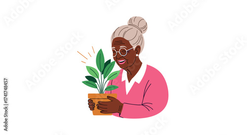 An elderly woman joyfully cares for her healthy green potted plant.