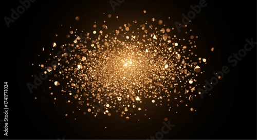 Golden light particles glitter and shimmer against a dark background.This creates a stunning effect, ideal for backgrounds.