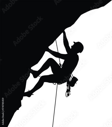 Black silhouette of climber ascending steep rock face