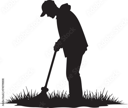 Black silhouette of a person sweeping grass lawn