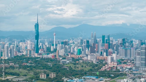 Wallpaper Mural Aerial view time lapse 4k video of Kuala Lumpur city center view during dawn overlooking the city skyline in Federal Territory, Malaysia. Tilt down Torontodigital.ca