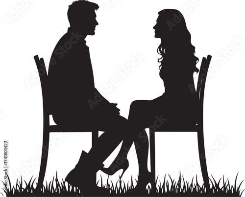 Silhouette couple sitting on chairs facing each other on grass