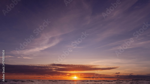 Wallpaper Mural Sunset over sea water with dramatic clouds and colorful sky in yellow,purple,blue.Beautiful evening seascape,golden hour background for travel design,summer relaxation scene,peaceful nature  Torontodigital.ca
