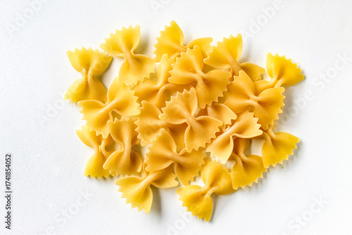 raw farfalle pasta isolated on white background