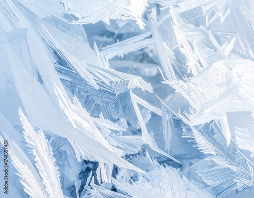 Delicate Ice Crystals Forming Intricate Patterns in Frozen Water Surface with Blue Hues Winter Season Abstract Textures