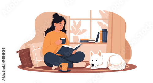 A person reads a book with a dog nearby.