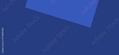 A navy blue backdrop is partially covered by an ultramarine geometric shape, creating a visually compelling composition with a minimalist aesthetic and a focus on color and form