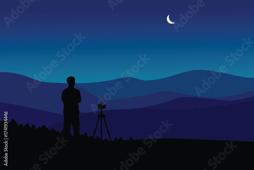 A lone photographer captures the night landscape under a crescent moon