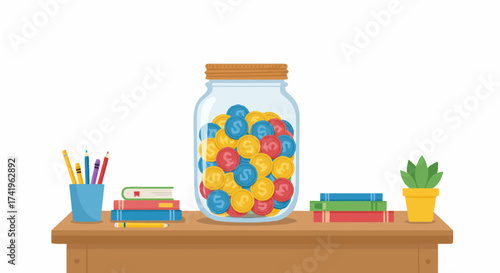 A glass savings jar filled with colorful dollar coins on a wooden desk with books, pencils, and a plant.