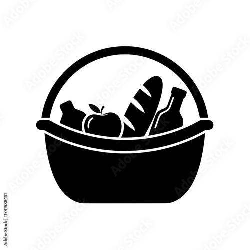 Picnic basket filled with food ready for a day out in the sun.