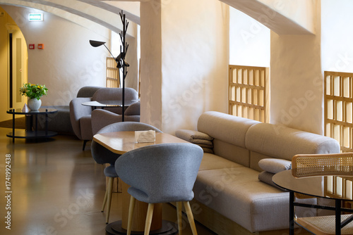 Canvas-taulu Modern lounge area with comfortable seating and soft lighting