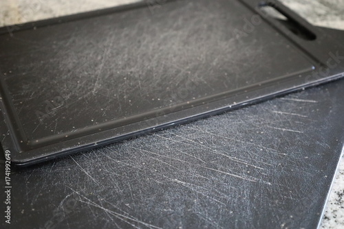 Black Plastic Cutting Boards with Knife Marks