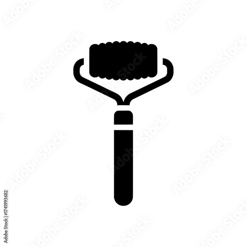 Facial massage tool for skincare routine black and white icon.