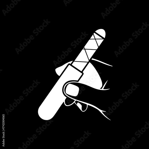 Hand holding a nail file for manicure and pedicure grooming.