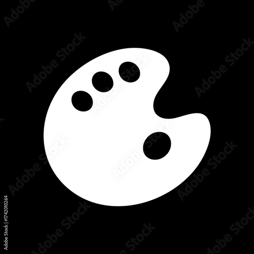 Artists paint palette with four black paint spots.
