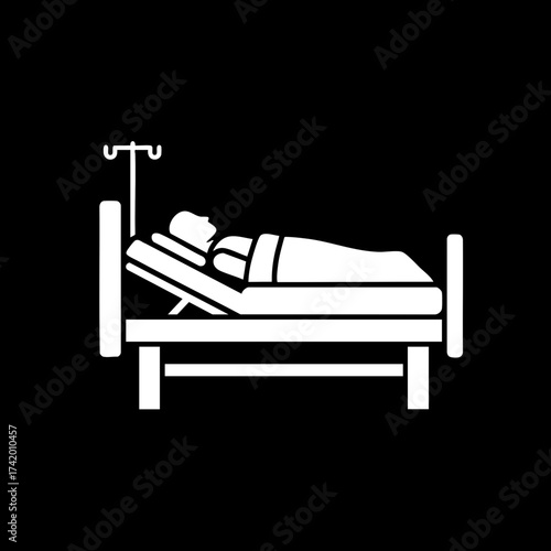 Patient lying in hospital bed with IV drip.