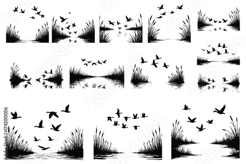 Black silhouettes of ducks flying over water with reeds