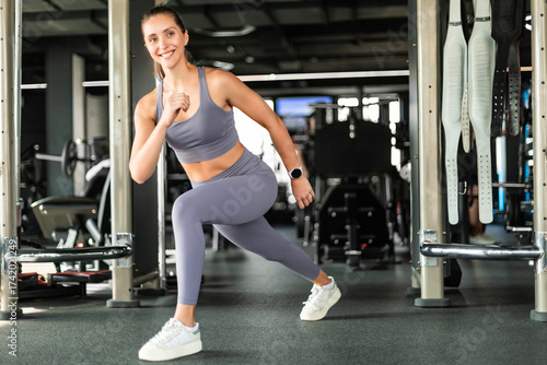 Wallpaper Mural Beautiful muscular fit woman exercising building muscles. Torontodigital.ca