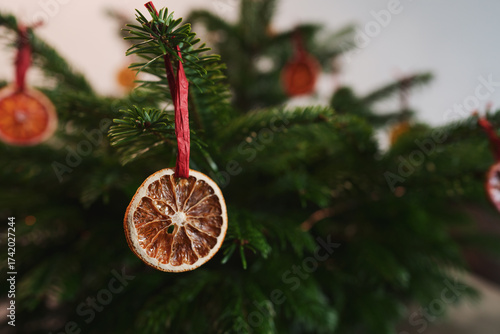 Closeup small christmas tree with natural decorations indoor