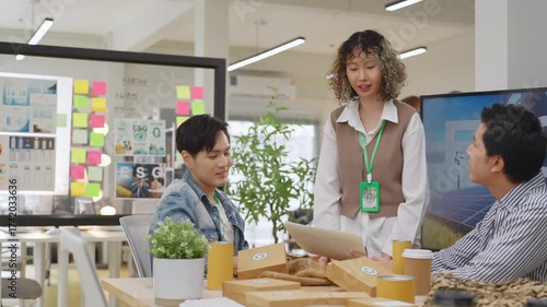 Creative business  product developers actively brainstorm ideas, sharing discussions ESG  green energy focusing on product repackaging and reuse strategies to reduce costs maximize profit business