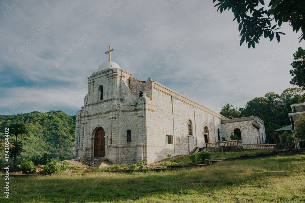 Naklejka premium Historic White Stone Colonial Church Set in Bato, Catanduanes, Bicol, Philippines