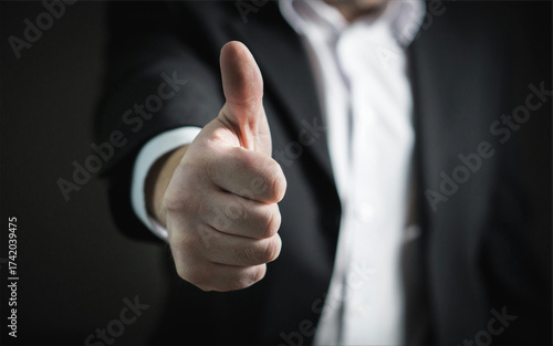 businessman showing thumbs up