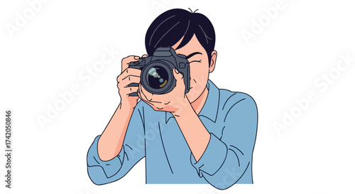 Focused photographer capturing moments through the lens of his professional camera while expertly holding it with both hands aimed at the subject