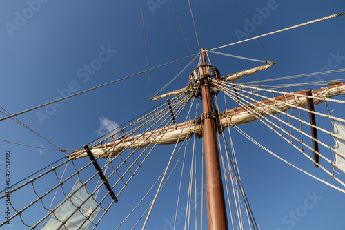 Santander, Spain. Wooden deck and masts with furled sails of the 2017 replica of the nao Santa Maria, flagship of Christopher Columbus 1492 expedition, docked at the port of Calderon