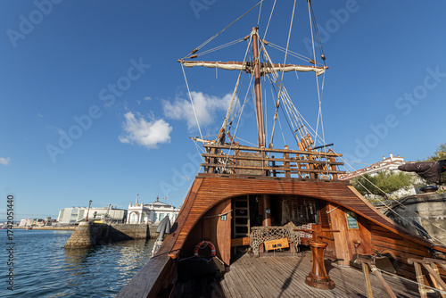Santander, Spain. Wooden deck and masts with furled sails of the 2017 replica of the nao Santa Maria, flagship of Christopher Columbus 1492 expedition, docked at the port of Calderon