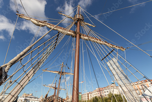Santander, Spain. Wooden deck and masts with furled sails of the 2017 replica of the nao Santa Maria, flagship of Christopher Columbus 1492 expedition, docked at the port of Calderon
